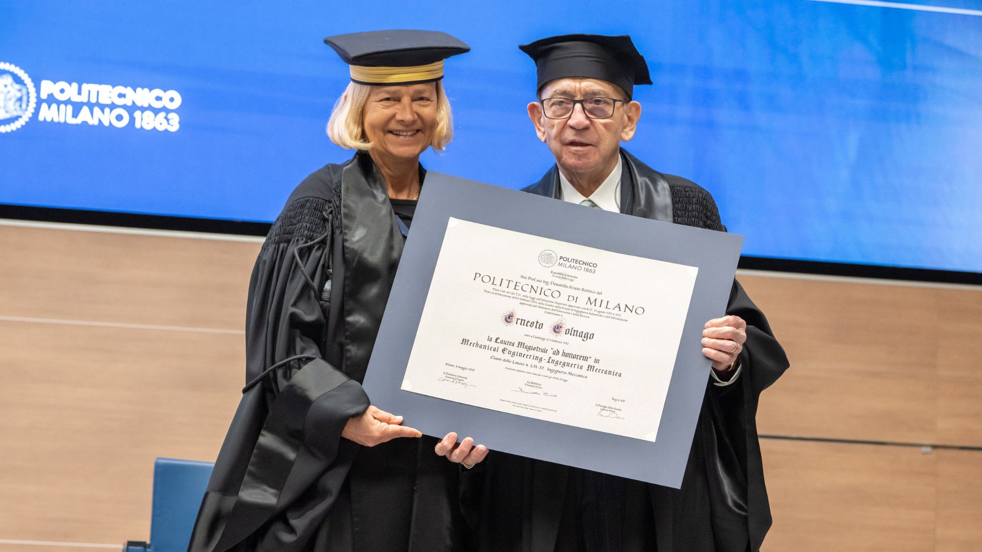 Donatella Sciuto and Ernesto Colnago with degree parchment
